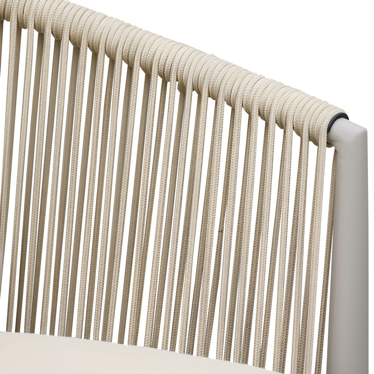 Featuring a close-up of The St. Tropez Collection by Landmark Decor, this chairs backrest boasts tightly arranged beige ropes on a sleek white frame, ideal for alfresco dining. These weather-resistant ropes form an appealing textured pattern, enduring the elements with ease.