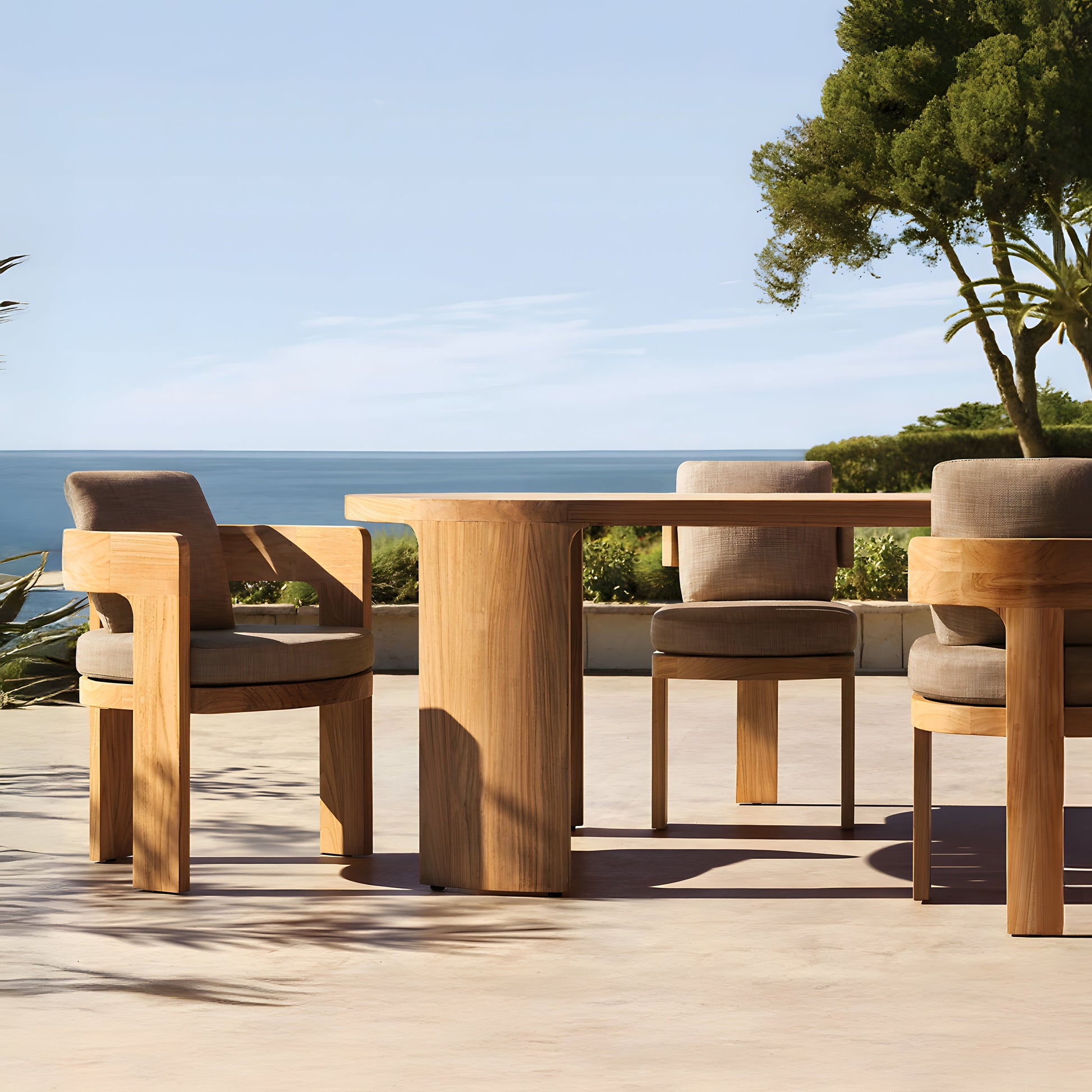 The Pacific Shoreline Collection by Landmark Decor features a wooden outdoor dining set with four cushioned chairs surrounding a rectangular table. Built from weather-resistant materials, its ideal for alfresco dining on a sunny patio overlooking serene coastal views.