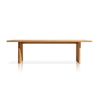 The Hidden Canyon Collection table by Landmark Decor is a minimalist design featuring a flat rectangular top and two sturdy vertical supports made from weather-resistant materials. Its light, natural wood finish is perfect for alfresco dining, showcased against a plain white backdrop.