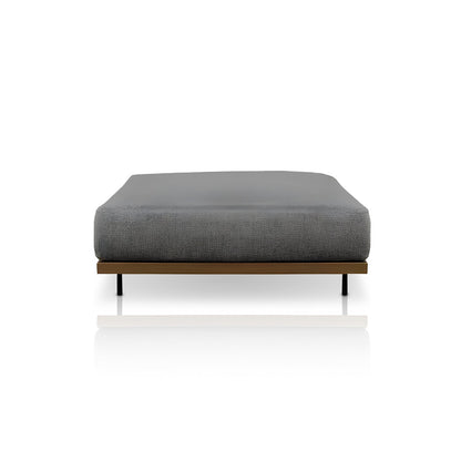 The Oceanview Oasis Collection by Landmark Decor features a minimalist, low-profile bed with a grey upholstered mattress on an all-weather frame, enhancing any sleek wooden backdrop with its simple and contemporary design.