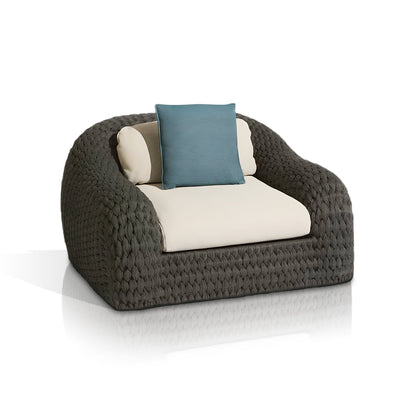 The Palermo Terra Collection by Landmark Decor features a modern armchair with a rounded all-weather frame, woven gray finish, cream-colored weather-resistant cushions, and a teal throw pillow. Ideal for outdoor sofas with its stylish design set against a white background.