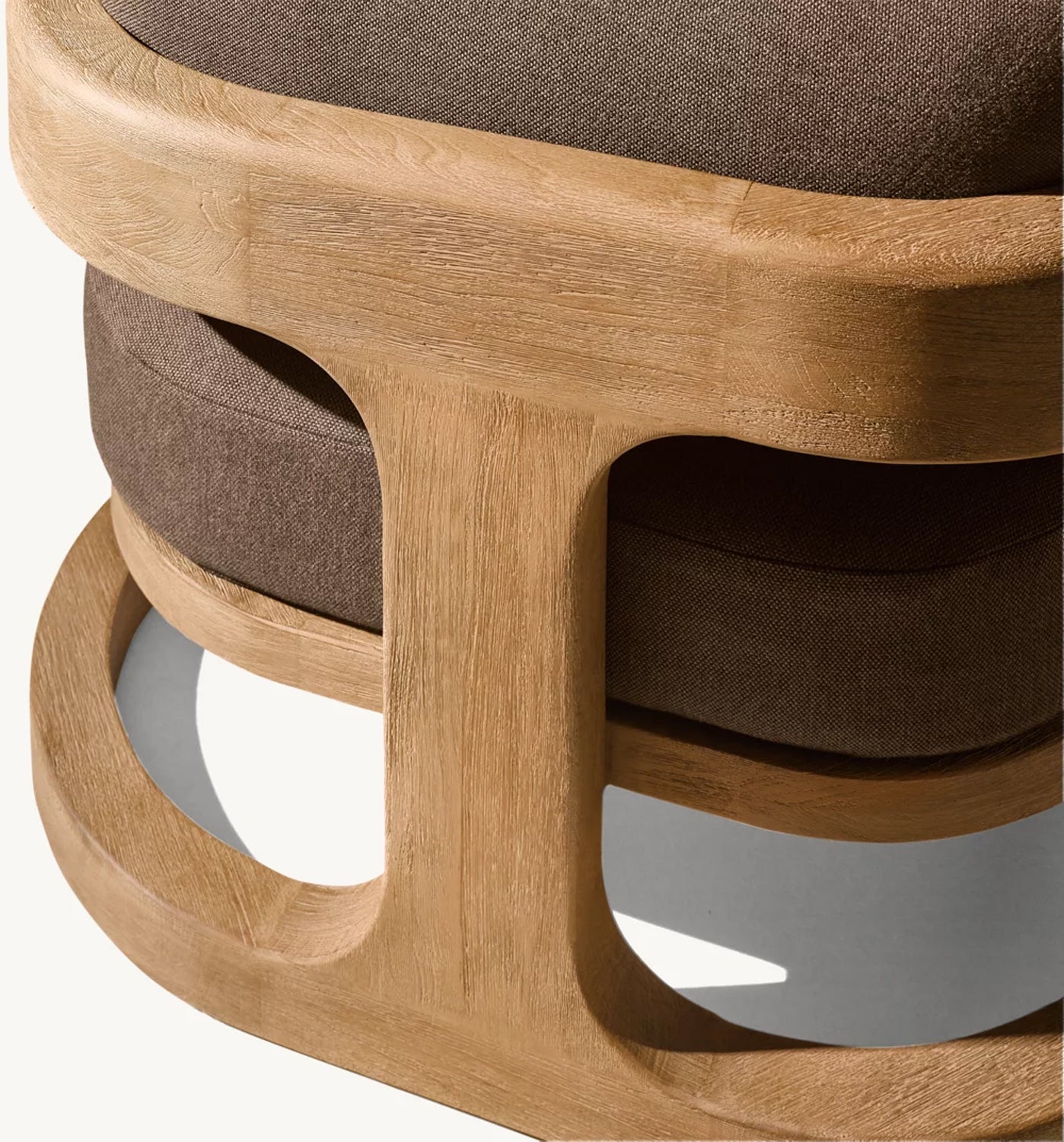 A close-up of a modern chair from the Serene Arc Collection by Landmark Decor showcases a sturdy light wood frame with smooth curves. The dark brown fabric seat contrasts elegantly, and all-weather frames enhance outdoor elegance through its natural materials and craftsmanship.