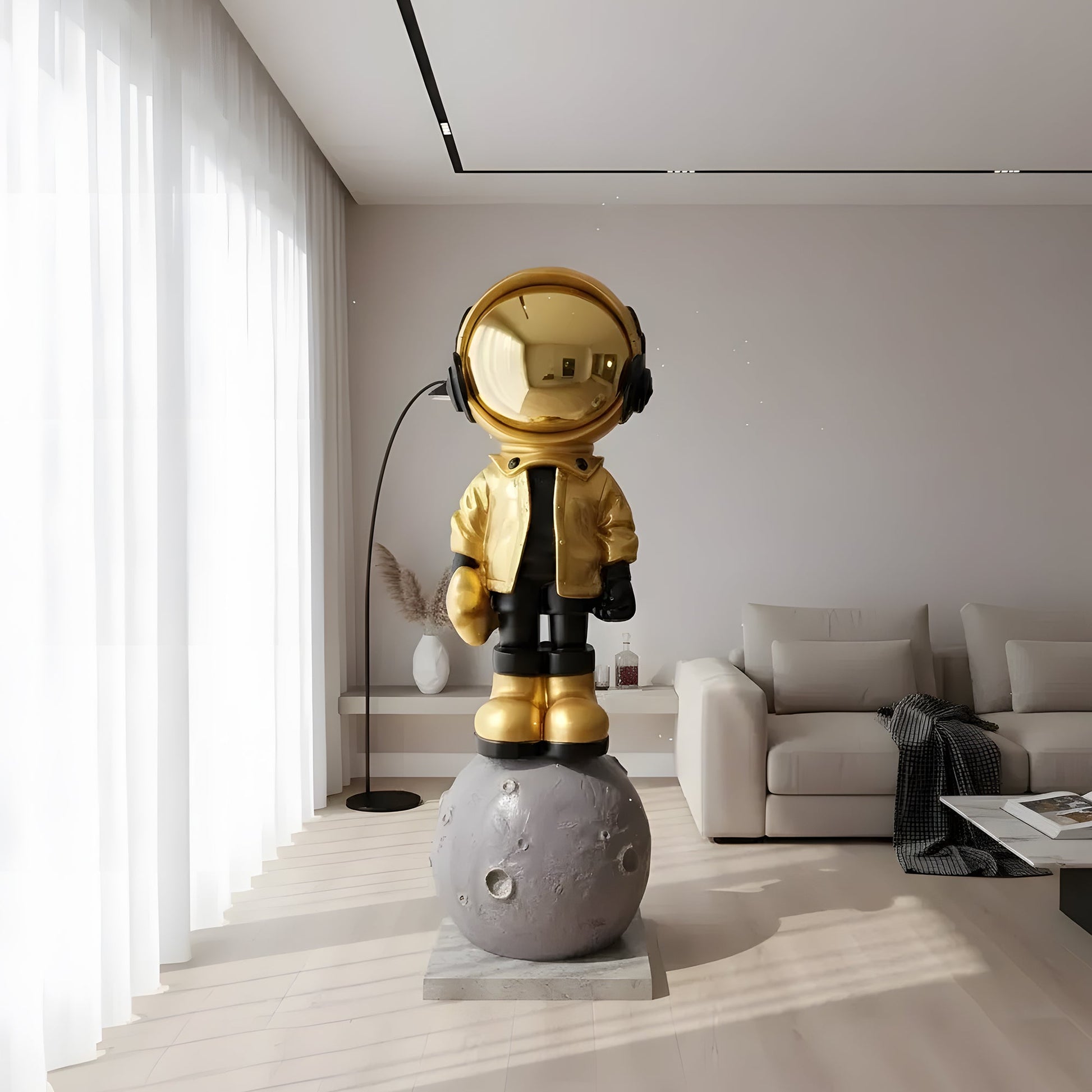The Astronaut of the Stars by Landmark Decor is a gold and black astronaut figurine with headphones, standing on a moon sculpture—perfect as unique artistic decor for modern living rooms.